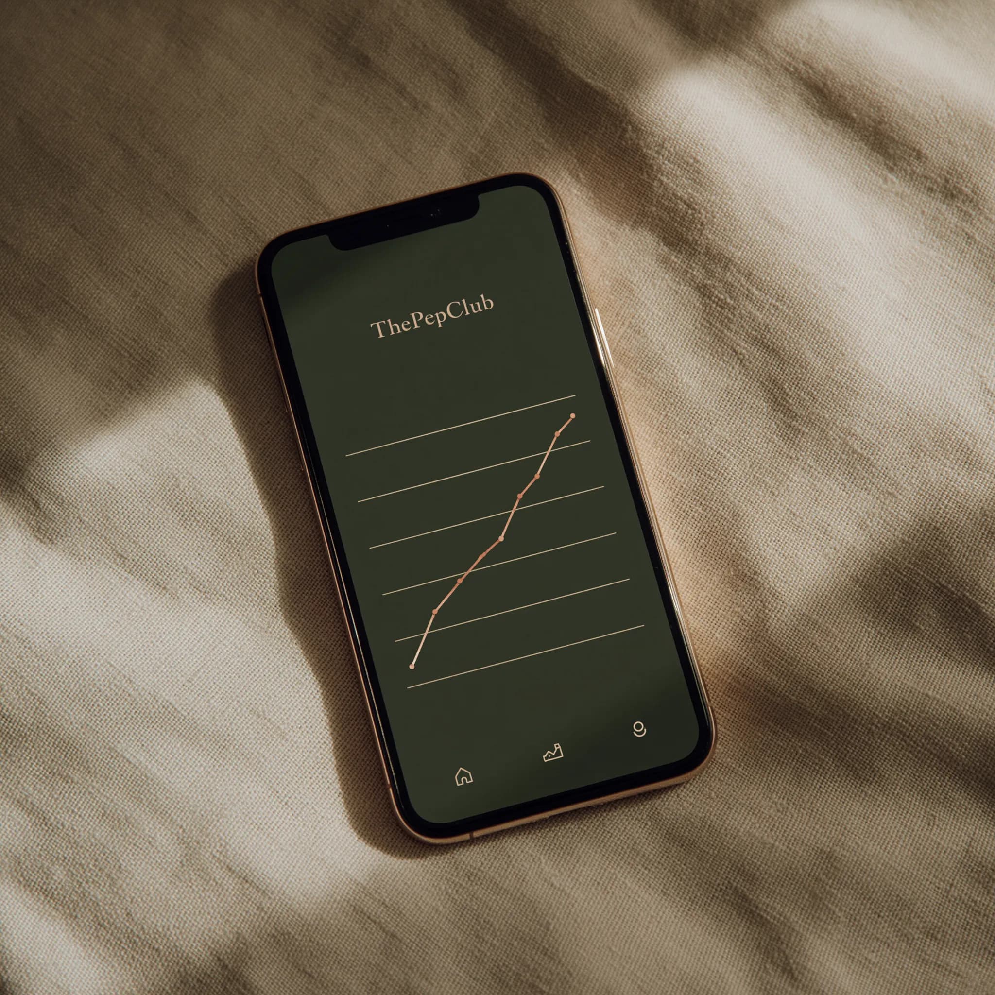Pep Club results dashboard on a phone resting on linen